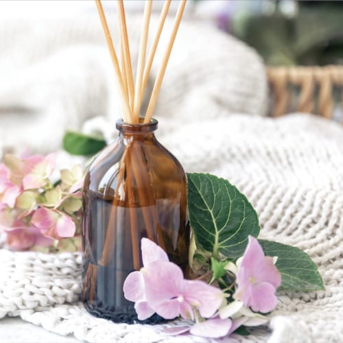 80ml amber glass reed diffuser with 5 naturally harvested canes — vegan, dye-free, cruelty-free essential oils diffuse long-lasting fragrance.